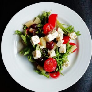Delicious Greek salad featuring fresh vegetables and creamy feta cheese, perfect for a healthy meal.