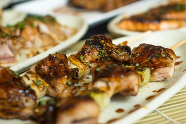 Delicious grilled meat skewers with sauce, perfect for a barbecue dish.